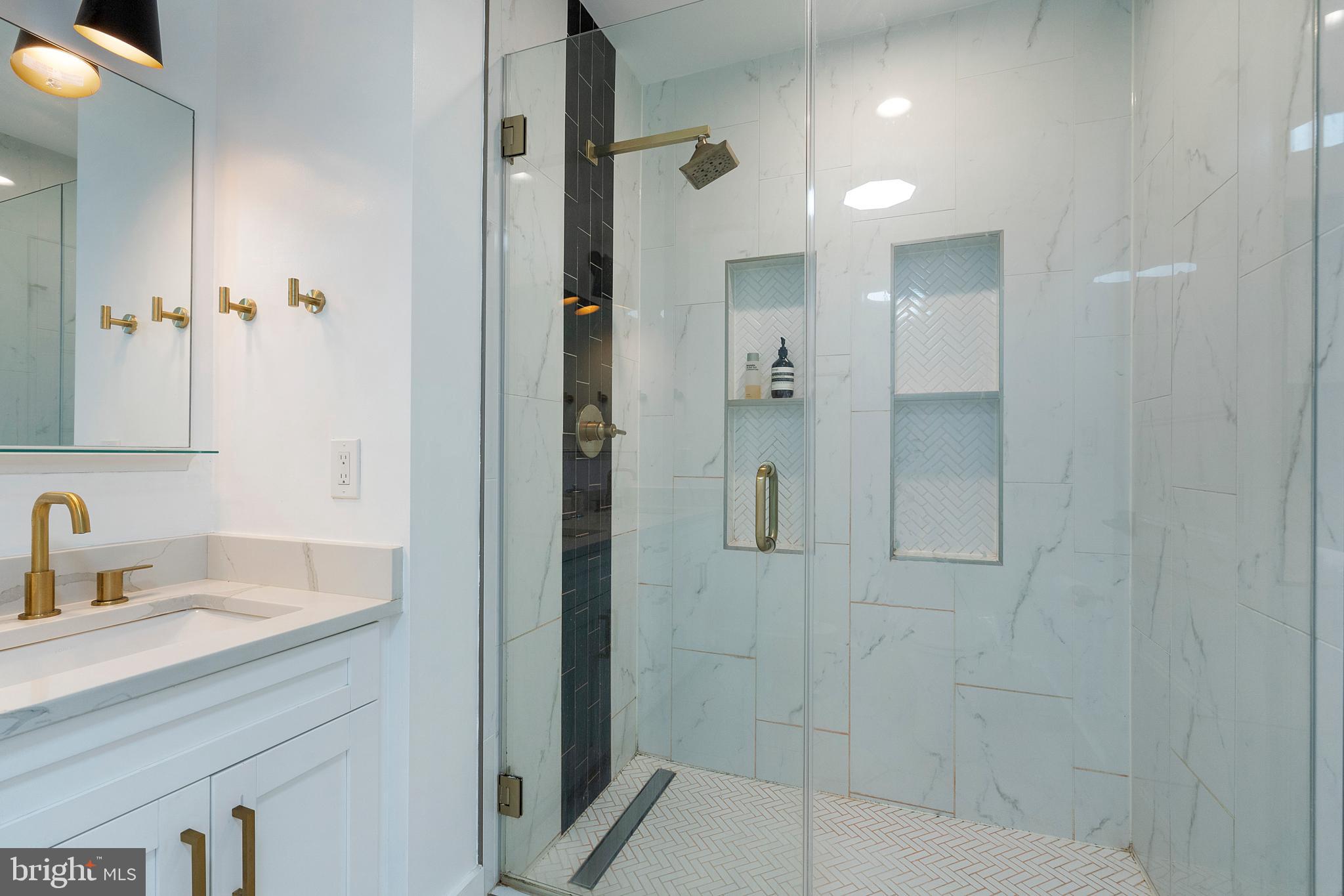 1427 West Virginia Avenue Northeast, Unit 1 Washington, DC 20002 - Photo 28 of 46 a bathroom with a shower sink and mirror