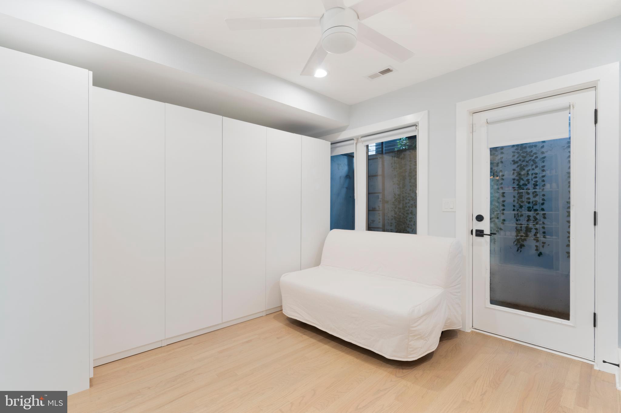 1427 West Virginia Avenue Northeast, Unit 1 Washington, DC 20002 - Photo 36 of 46 a living room with furniture and a ceiling fan