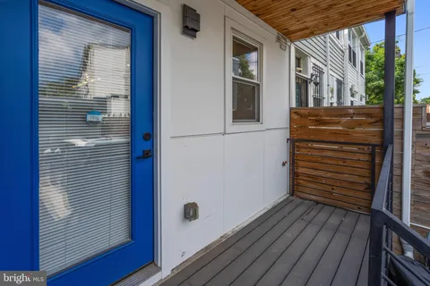 a view of a car parked in front of a building