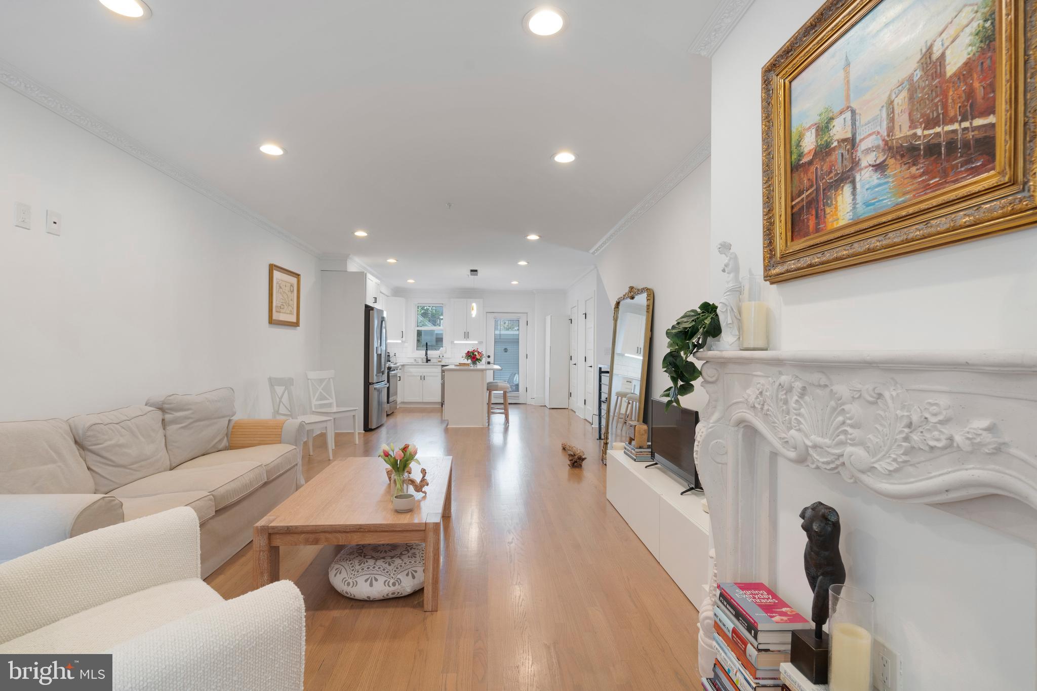 1427 West Virginia Avenue Northeast, Unit 1 Washington, DC 20002 - Photo 8 of 46 a living room with furniture and a fireplace