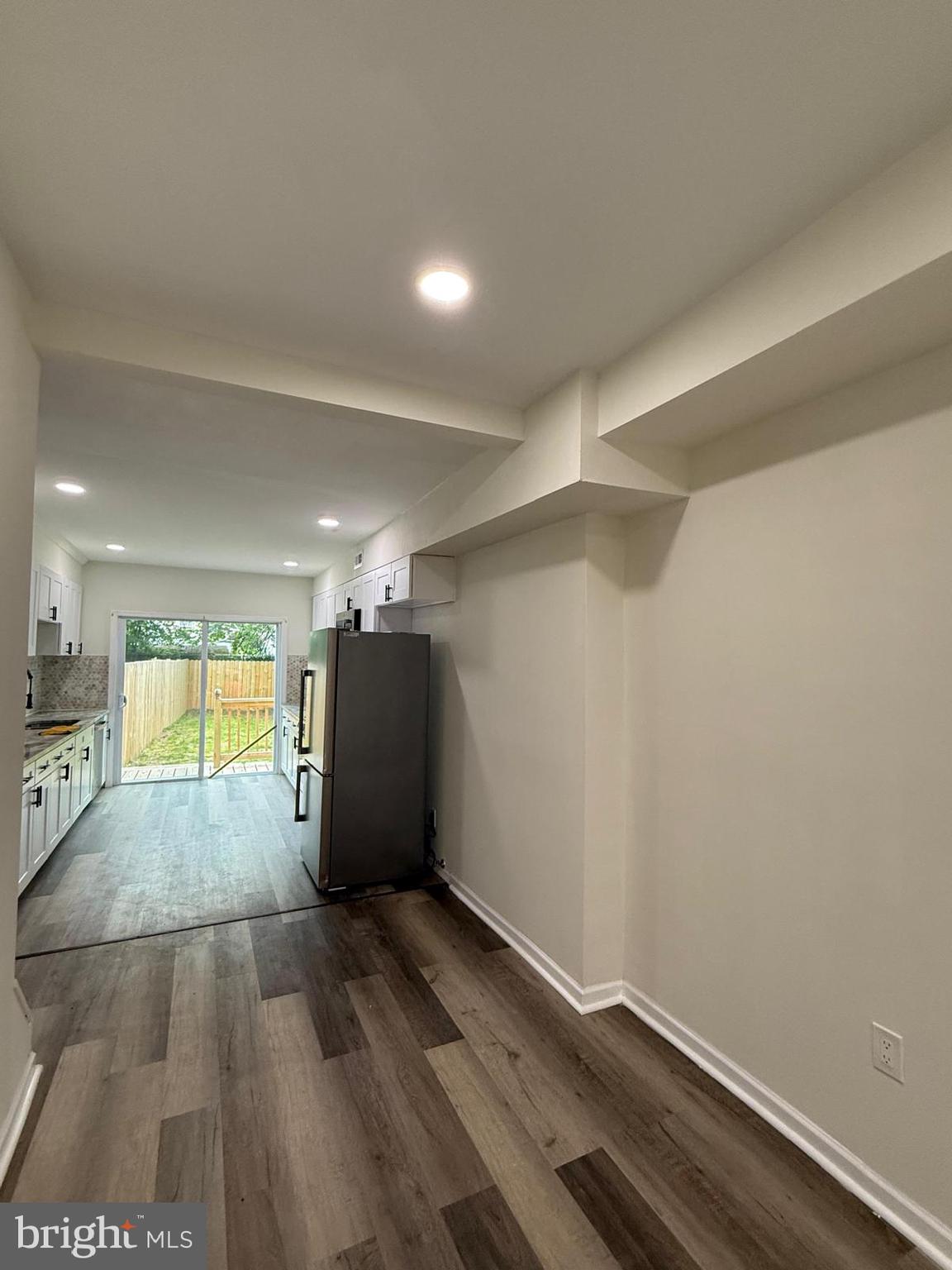 516 Columbus Road Burlington, NJ 08016 - Photo 3 of 12 an empty room with wooden floor and windows