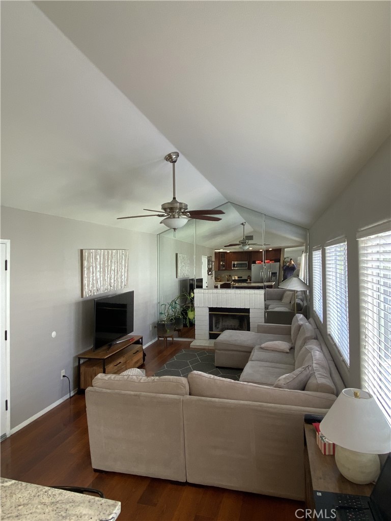 11682 Mt Baker Court Rancho Cucamonga, CA 91737 - Photo 5 of 5 a living room with furniture a flat screen tv and a fireplace