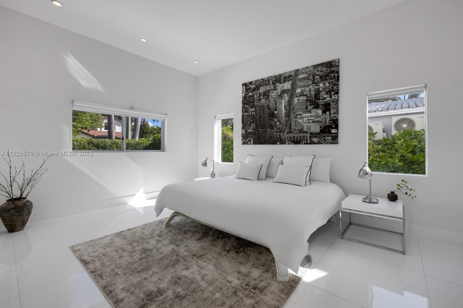 6050 La Gorce Drive Miami Beach, FL 33140 - Photo 11 of 31 a living room with furniture and a window