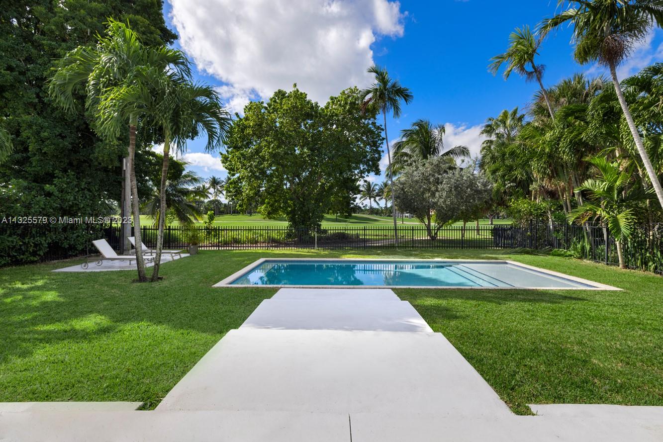 6050 La Gorce Drive Miami Beach, FL 33140 - Photo 25 of 31 a view of backyard with swimming pool