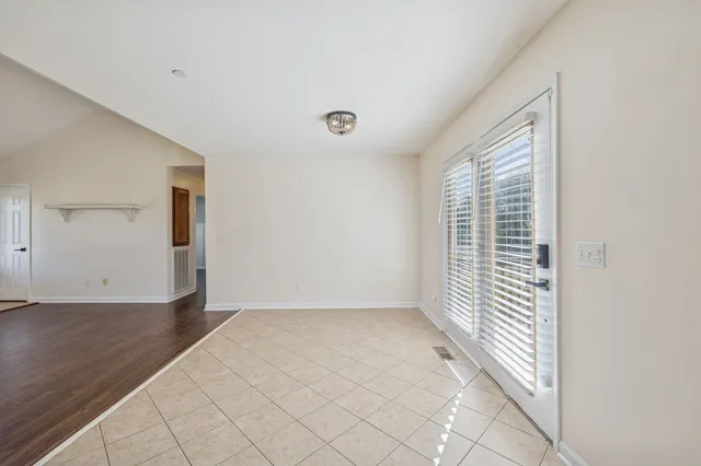 a kitchen with a sink refrigerator and cabinets