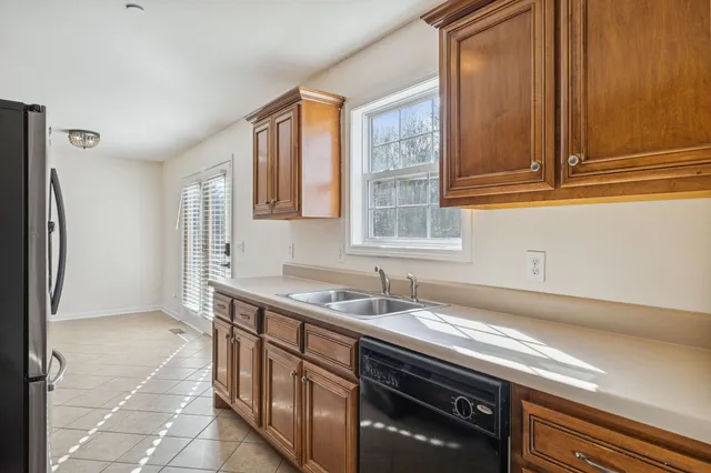 a kitchen with stainless steel appliances granite countertop a stove microwave and refrigerator