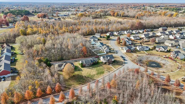 an aerial view of a house with a swimming pool