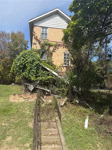 a backyard of a house with lots of green space