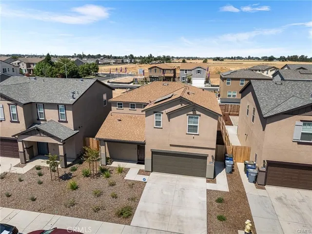 an aerial view of a house with a terrace