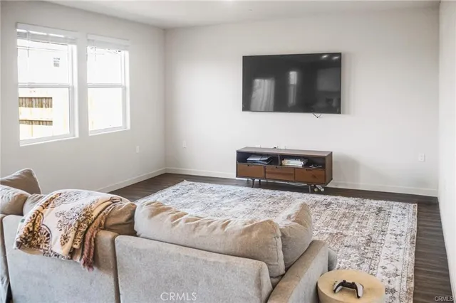 a bedroom with a bed and a television