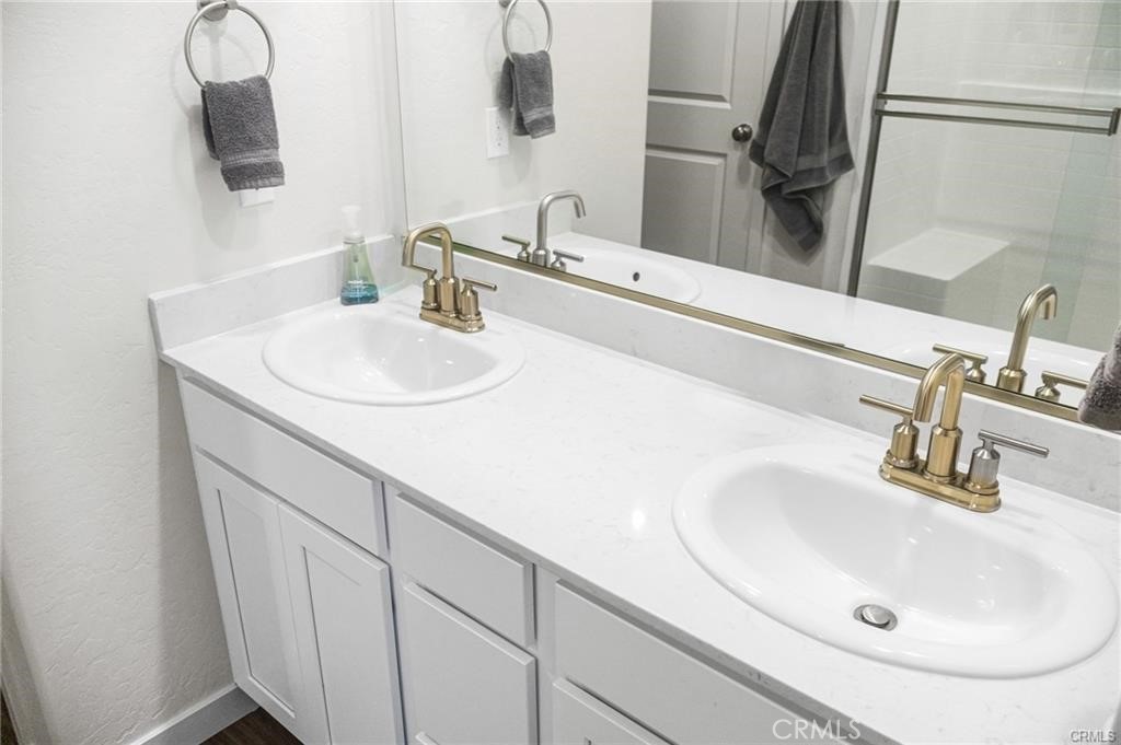 4119 Anise Court Merced, CA 95348 - Photo 10 of 17 a bathroom with a sink and a mirror