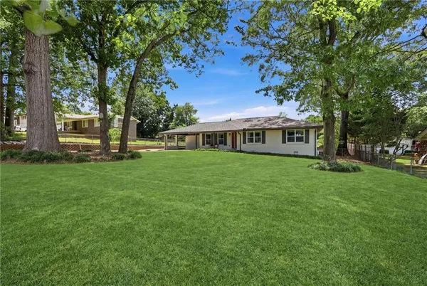 a view of a house with a big yard