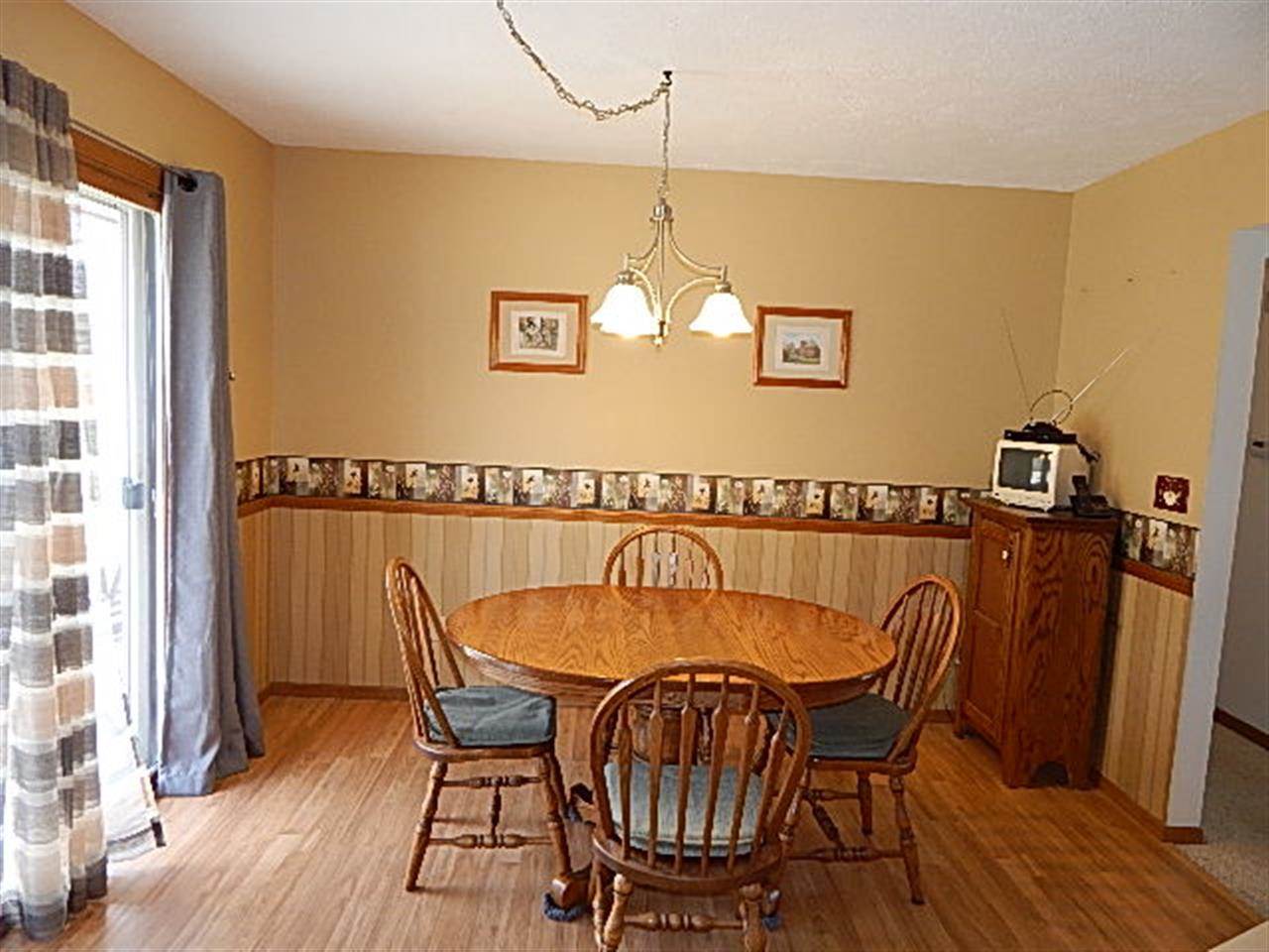 9925 Bitterroot Road Roscoe, IL 61073 - Photo 10 of 25 a table and chairs in a balcony