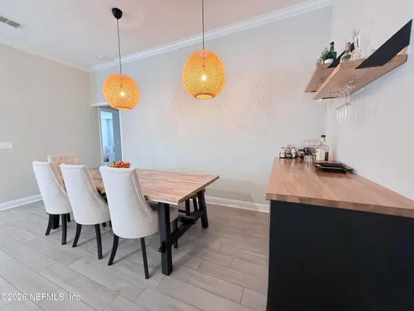 a view of a dining room and chairs