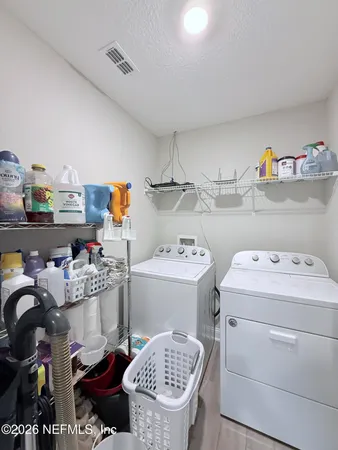 a storage room with washer and dryer