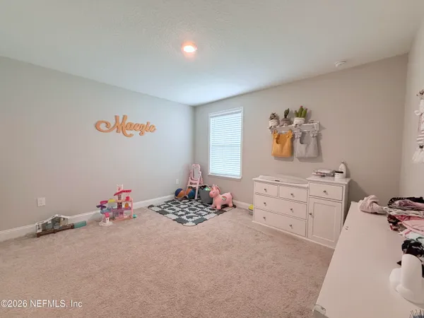 a room with toys and dresser