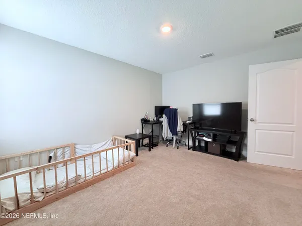 a room with furniture and a flat screen tv