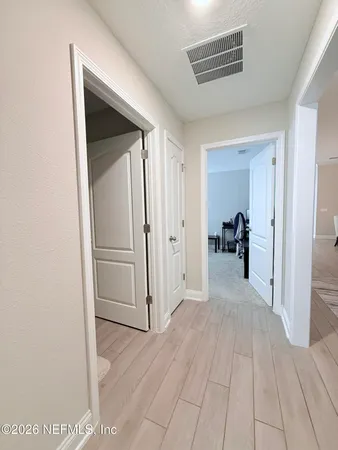 a view of a livingroom with a dinning table and staircase
