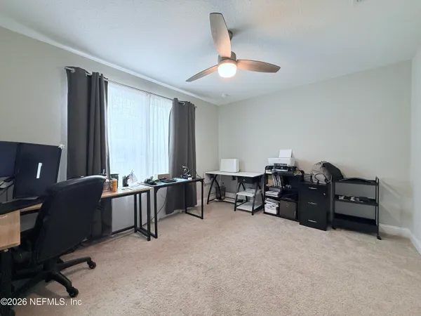 a bed room with furniture and a window