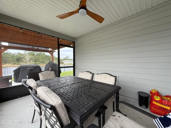 a view of a dining room with furniture window and outside view