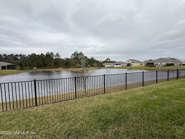 a view of a garden and lake