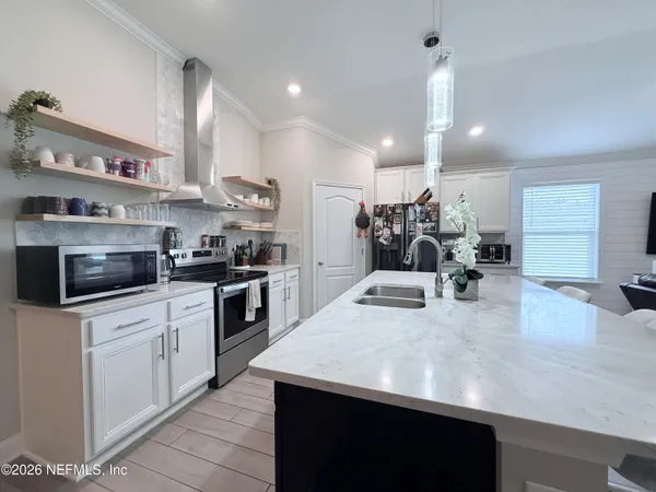a kitchen with counter top space cabinets and stainless steel appliances
