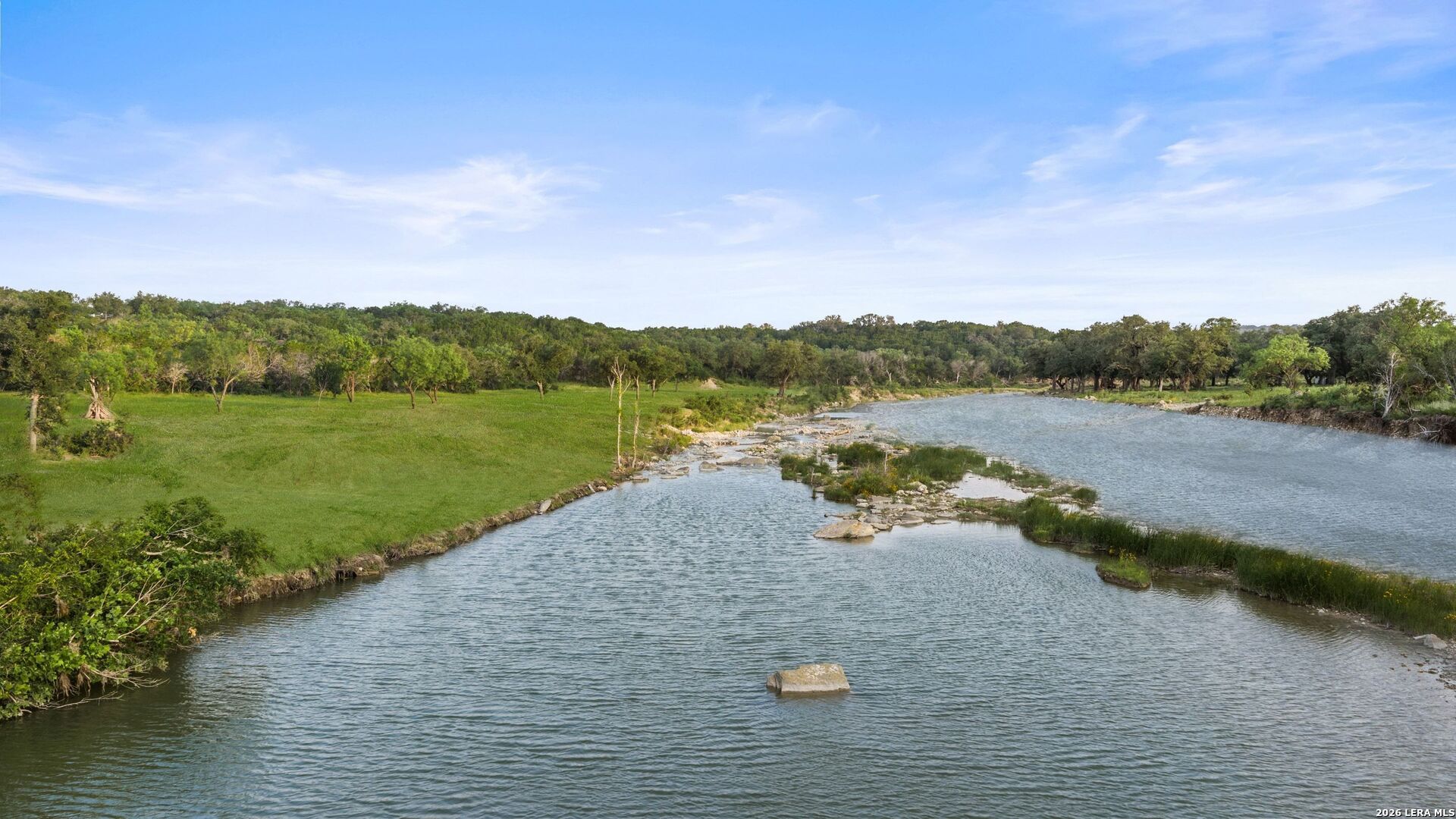 3402 Mormon Mill Road Marble Falls, TX 78654 - Photo 22 of 29 a view of a lake with a mountain in the background