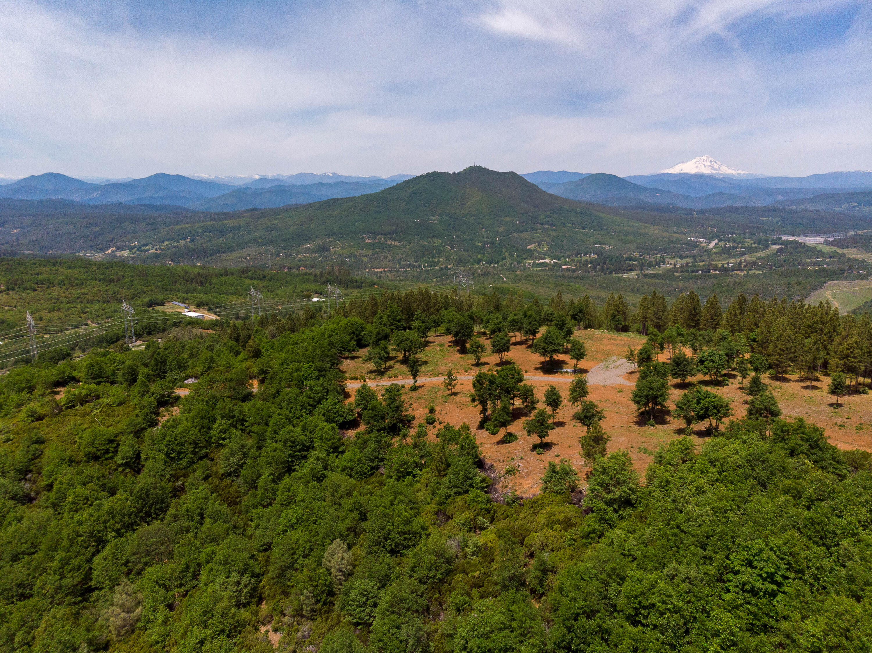 320 Acres Melton Road Bella Vista, CA 96008 - Photo 17 of 19 a view of a town with mountains in the background