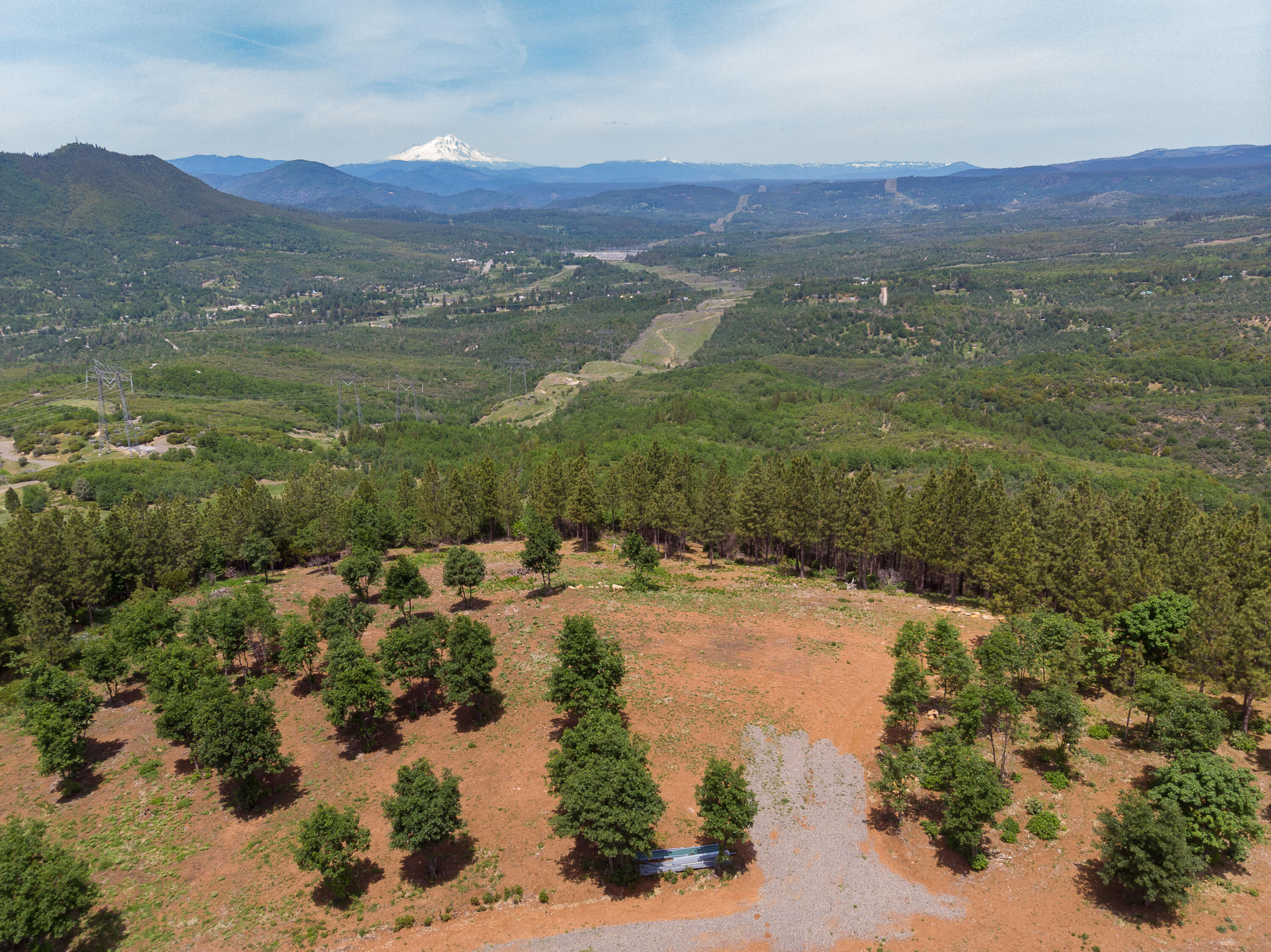 320 Acres Melton Road Bella Vista, CA 96008 - Photo 18 of 19 a view of a lake with mountains in front of it