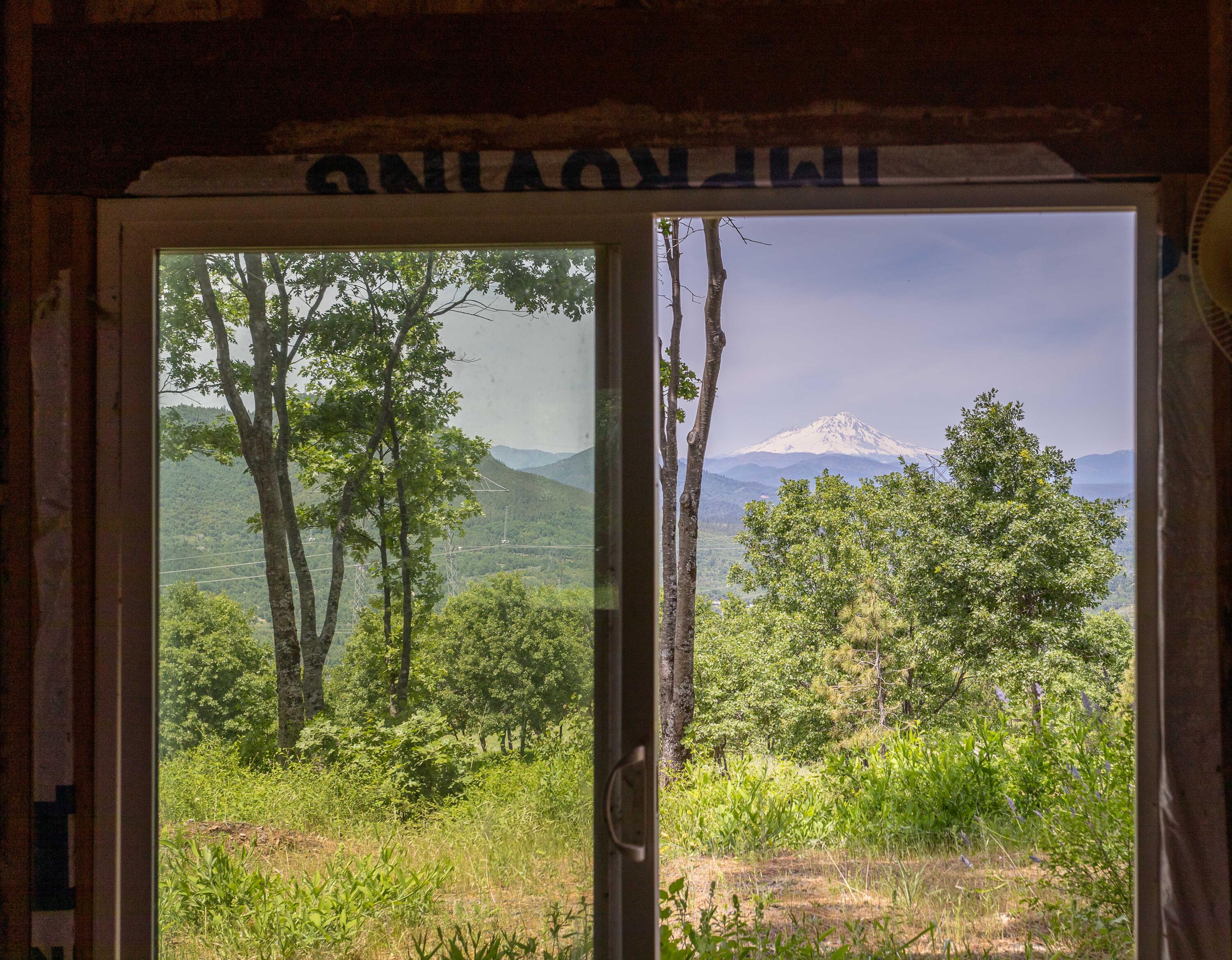 320 Acres Melton Road Bella Vista, CA 96008 - Photo 5 of 19 a view of a garden from a window