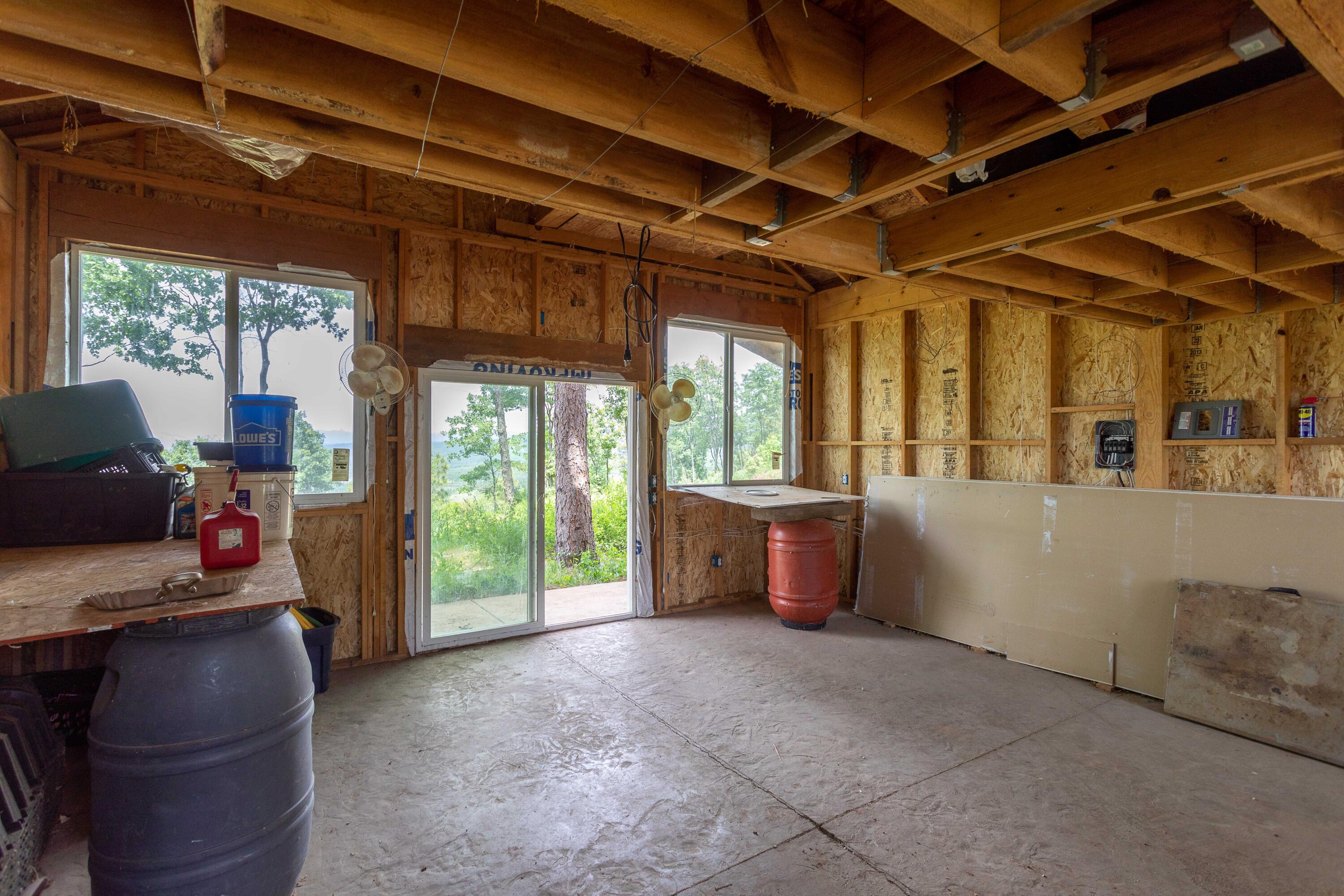 320 Acres Melton Road Bella Vista, CA 96008 - Photo 6 of 19 a room with furniture and a large window