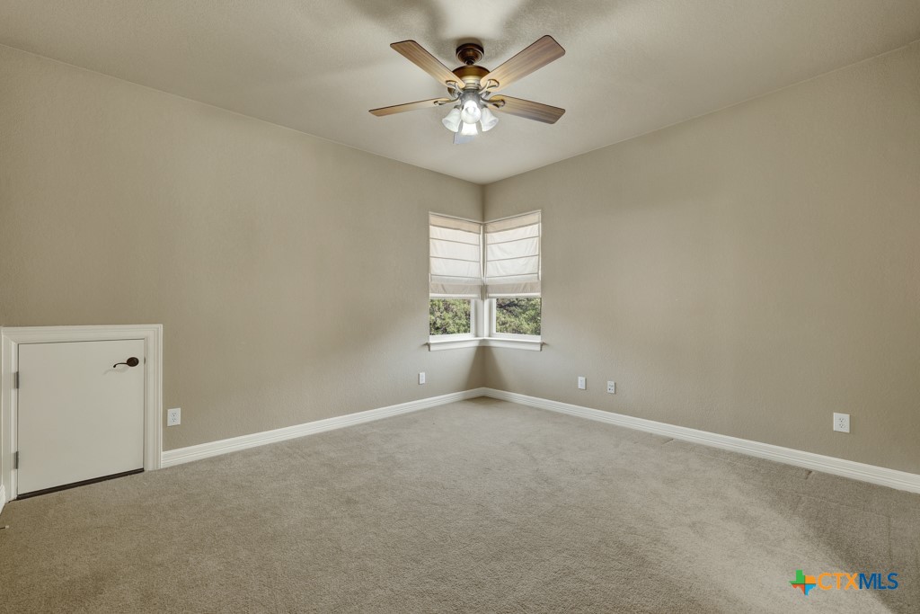 7607 Sky Loop Garden Ridge, TX 78266 - Photo 31 of 43 a view of an empty room with a window