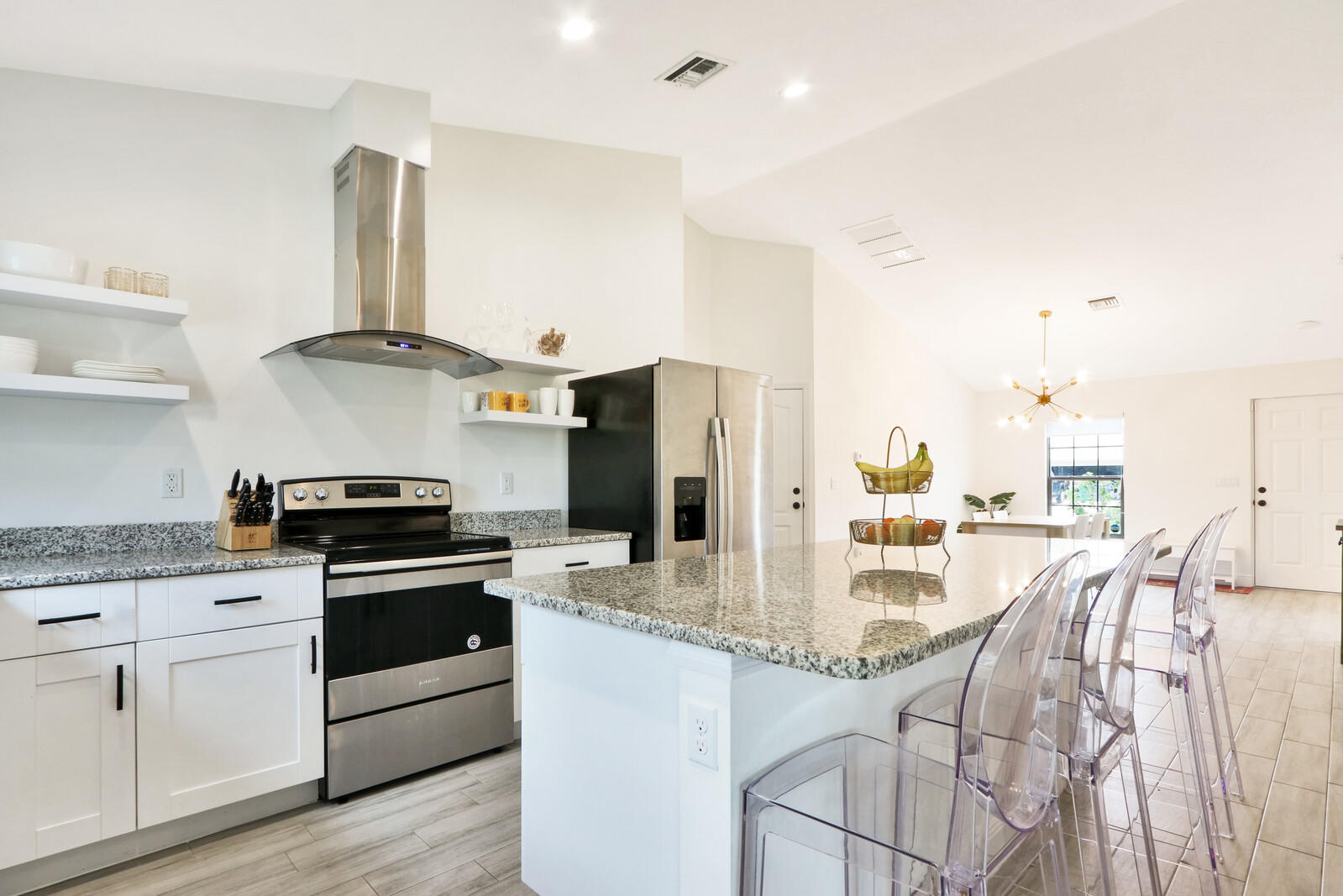 1423 Southwest Gilroy Road Port St. Lucie, FL 34953 - Photo 2 of 25 Kitchen with Dining Island
