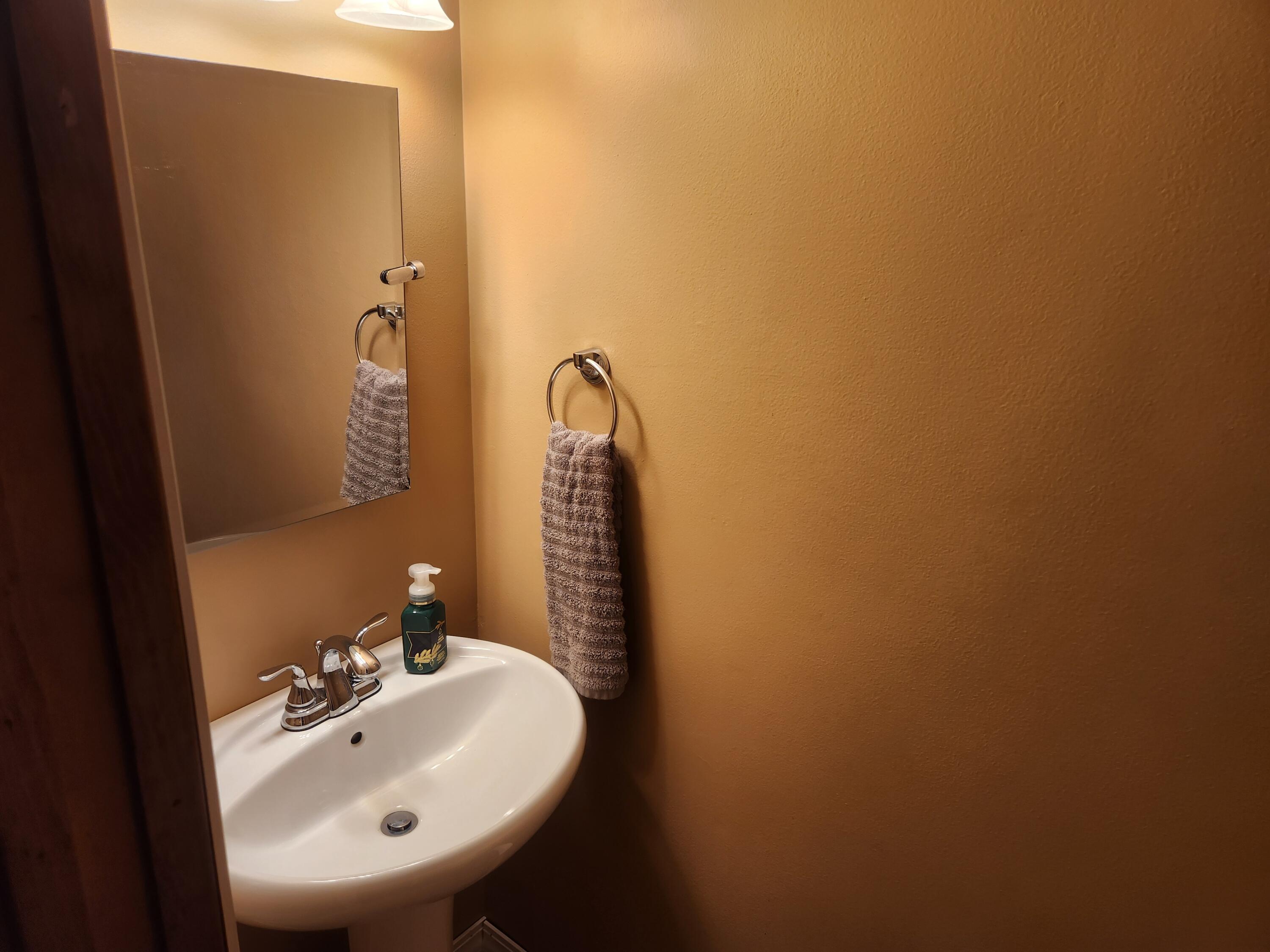 4726 Locksley Drive East Rensselaer, IN 47978 - Photo 18 of 33 a bathroom with a sink and a mirror
