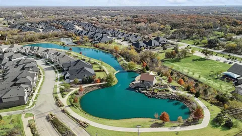 an aerial view of a residential houses with outdoor space