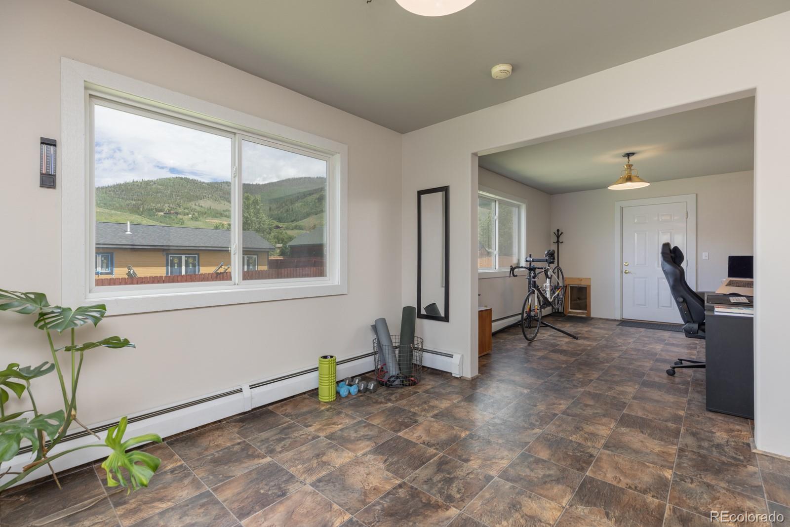213 Big Elk Road Dillon, CO 80435 - Photo 15 of 50 a view of a room with gym equipment and a large window