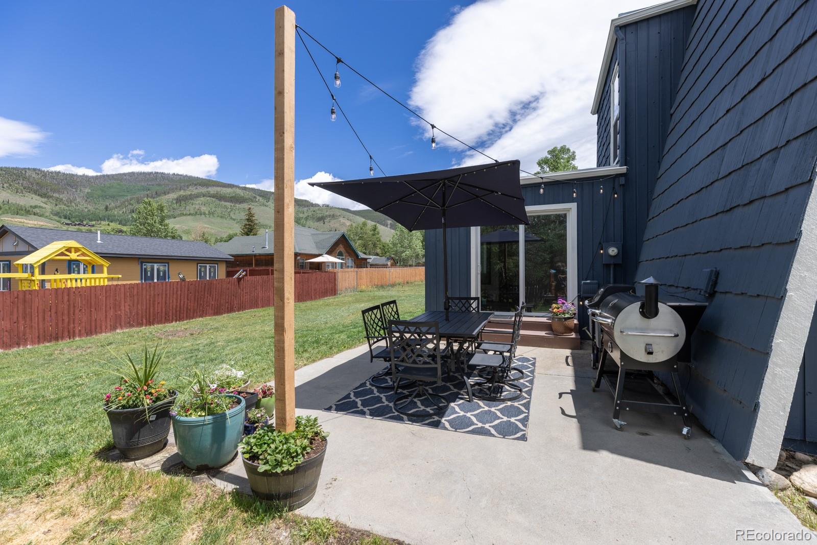 213 Big Elk Road Dillon, CO 80435 - Photo 17 of 50 a view of a patio with chairs and potted plants