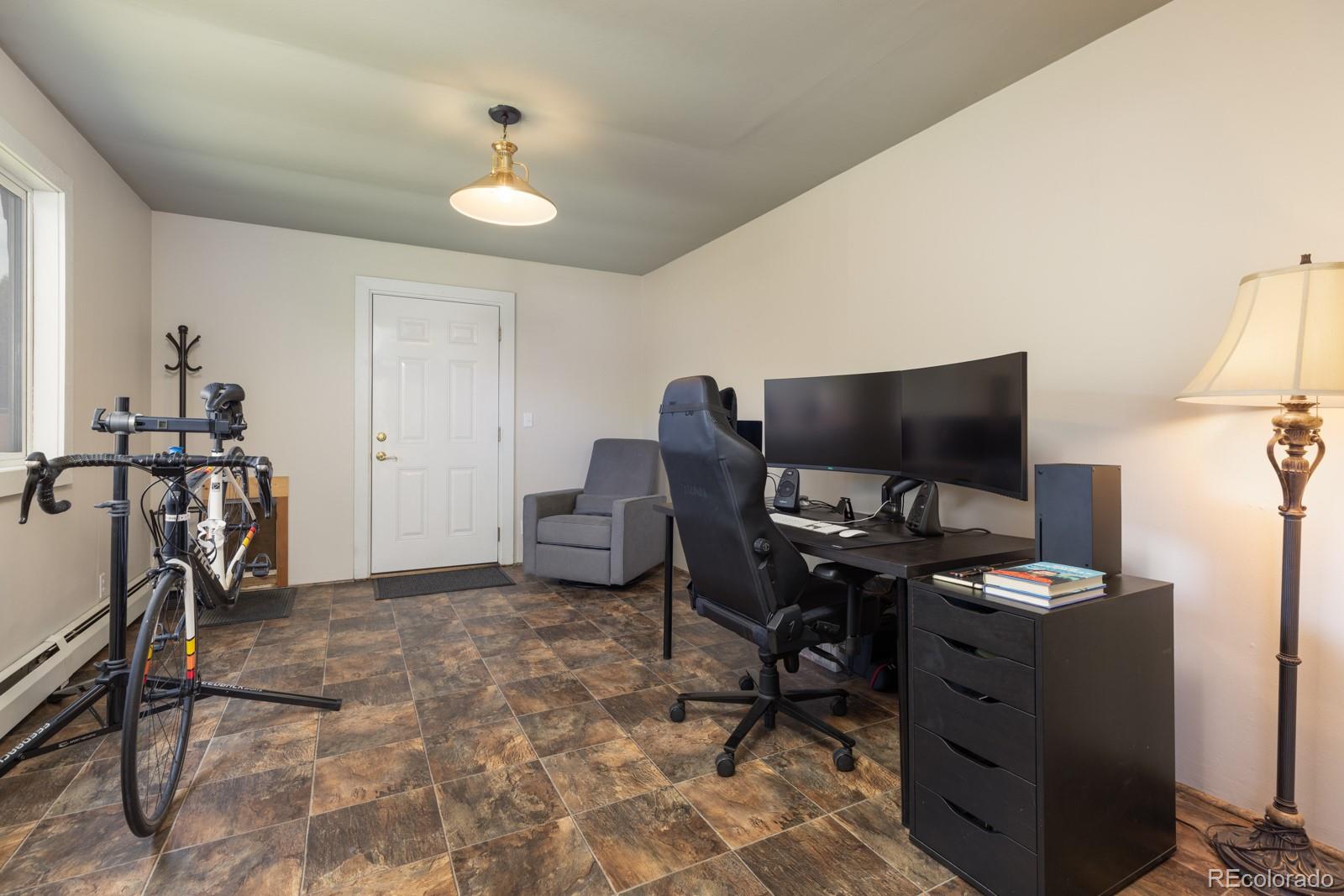 213 Big Elk Road Dillon, CO 80435 - Photo 18 of 50 a view of a workspace with furniture and a window