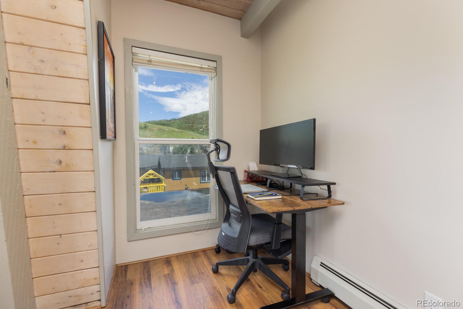 213 Big Elk Road Dillon, CO 80435 - Photo 35 of 50 a view of a workspace with furniture and wooden floor