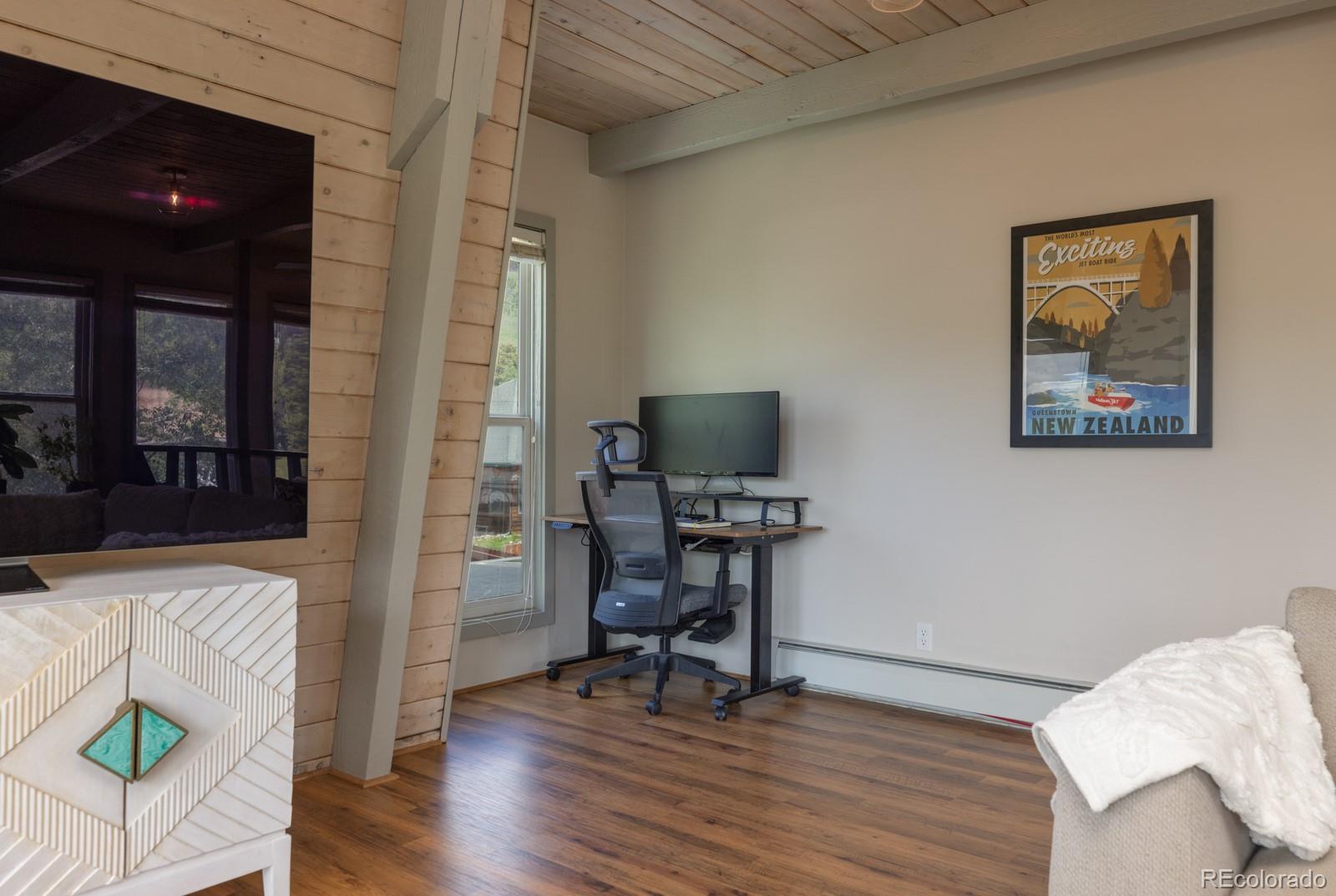 213 Big Elk Road Dillon, CO 80435 - Photo 36 of 50 a view of a workspace with furniture and wooden floor