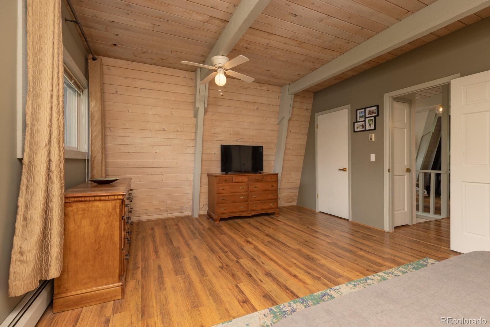 213 Big Elk Road Dillon, CO 80435 - Photo 38 of 50 a view of an empty room with wooden floor and a window