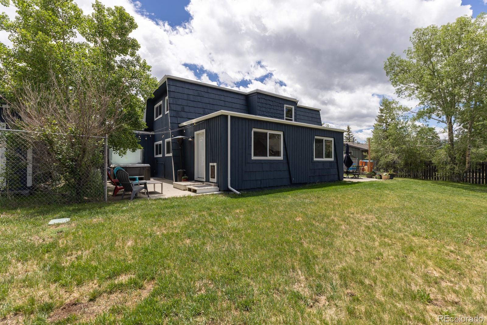 213 Big Elk Road Dillon, CO 80435 - Photo 44 of 50 a view of a house with backyard porch and garden