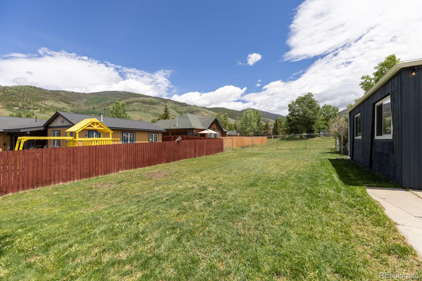 213 Big Elk Road Dillon, CO 80435 - Photo 45 of 50 a view of swimming pool with lawn chairs and plants