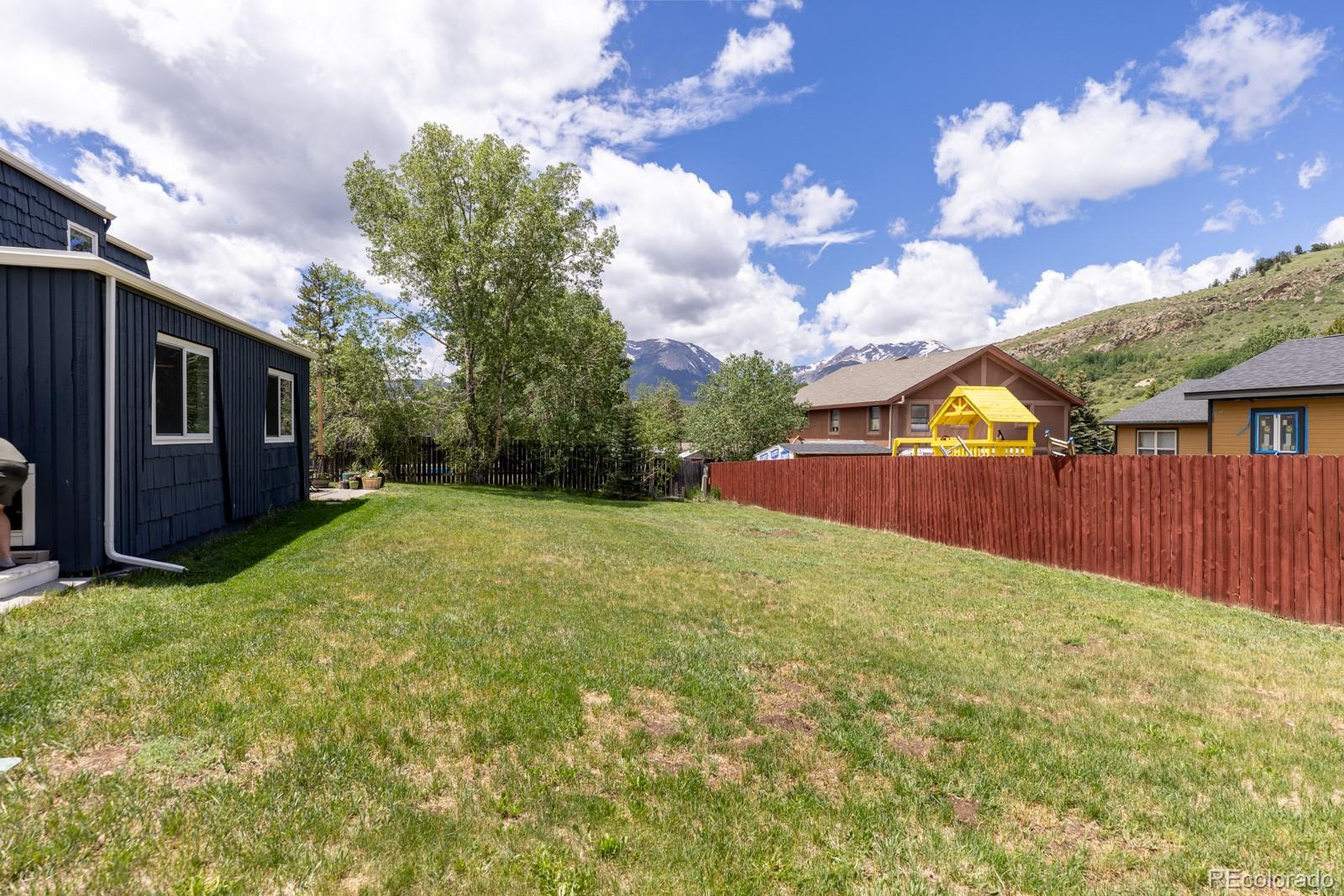 213 Big Elk Road Dillon, CO 80435 - Photo 47 of 50 a view of backyard with a garden and trees