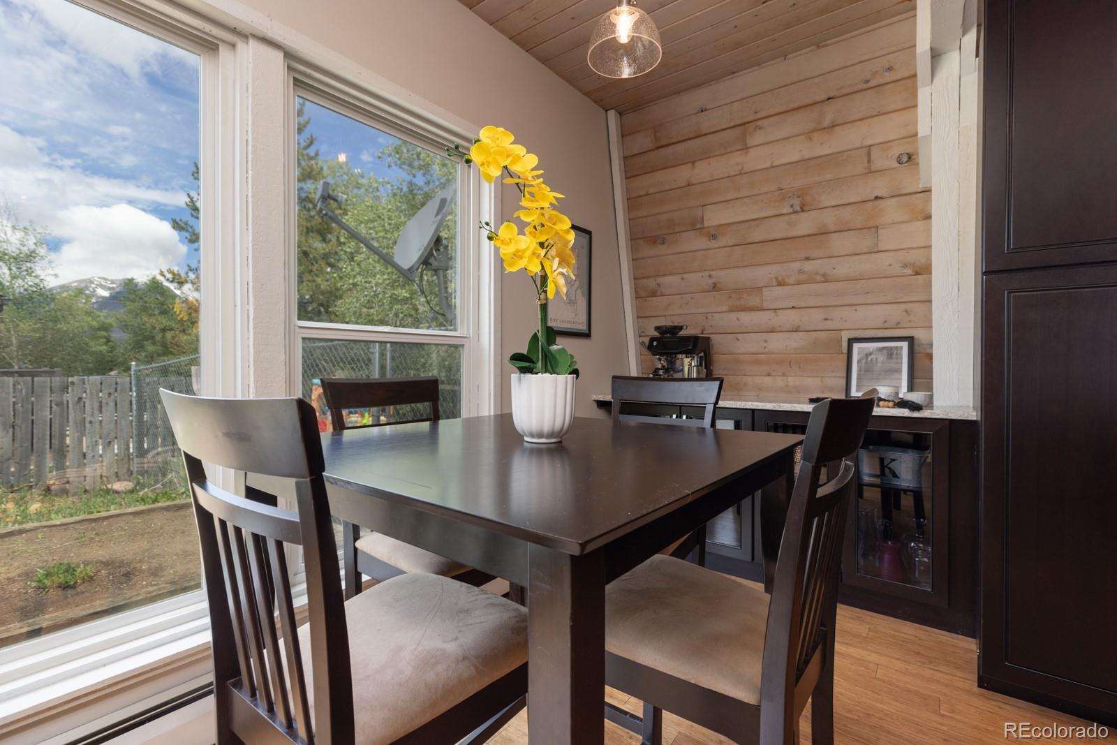 213 Big Elk Road Dillon, CO 80435 - Photo 9 of 50 a view of a dining room with furniture and wooden floor