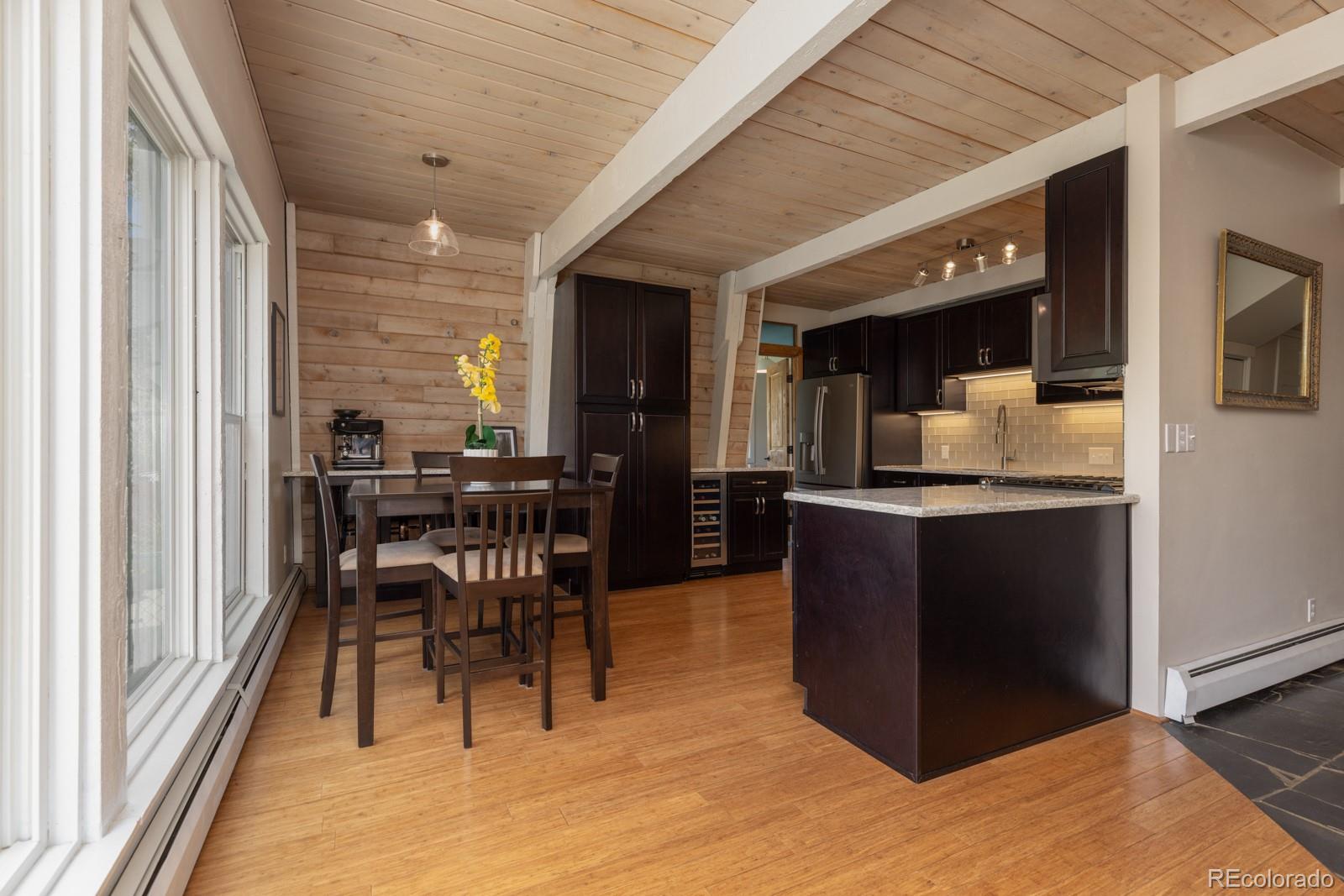 213 Big Elk Road Dillon, CO 80435 - Photo 10 of 50 a dining hall with stainless steel appliances granite countertop furniture and a kitchen view