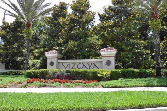 a view of a house with a yard and garden