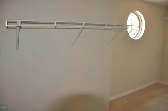 a view of a room with racks on the wall