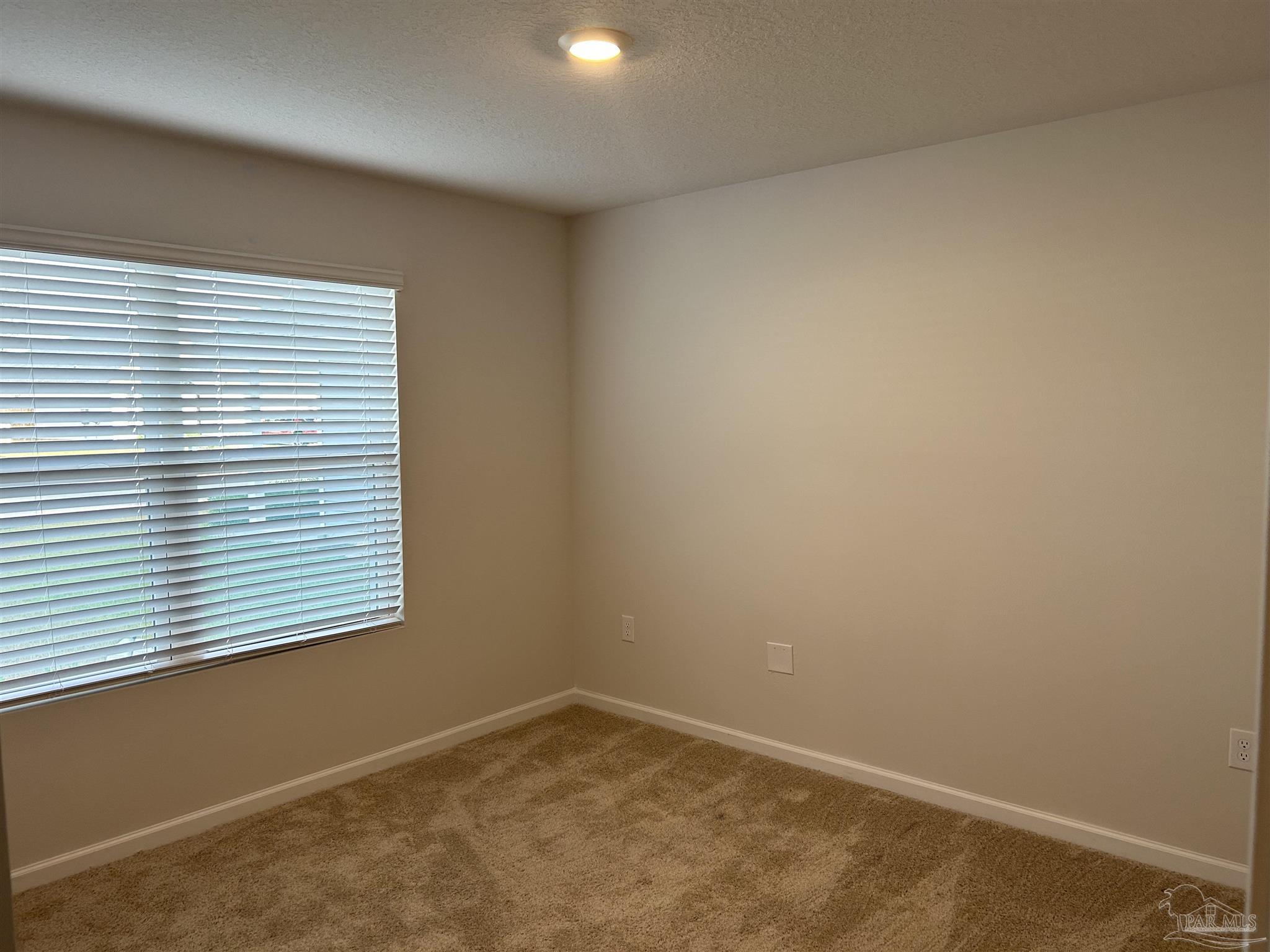 5351 Peach Drive Pace, FL 32571 - Photo 13 of 24 an empty room with a window