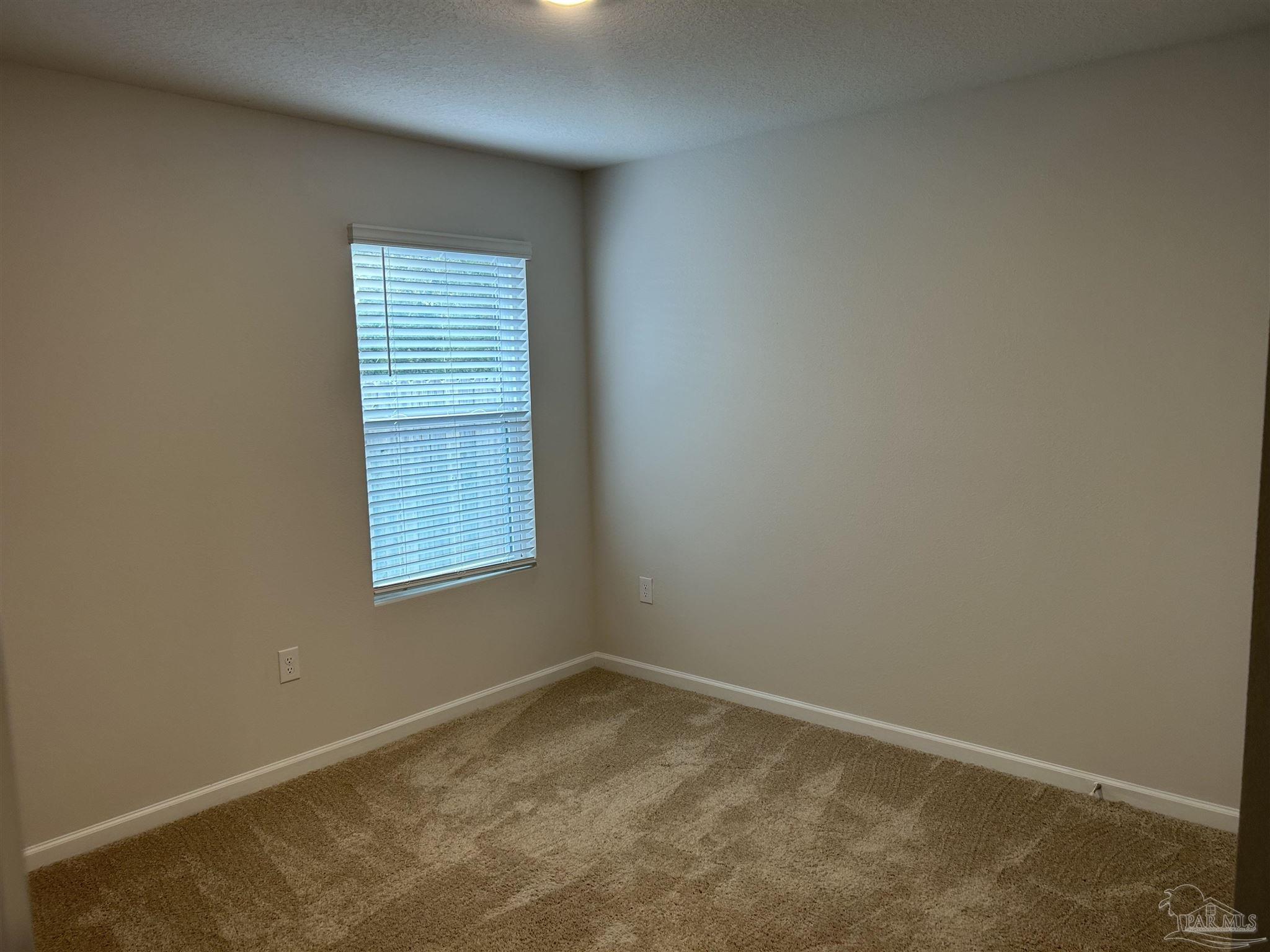 5351 Peach Drive Pace, FL 32571 - Photo 14 of 24 an empty room with a window